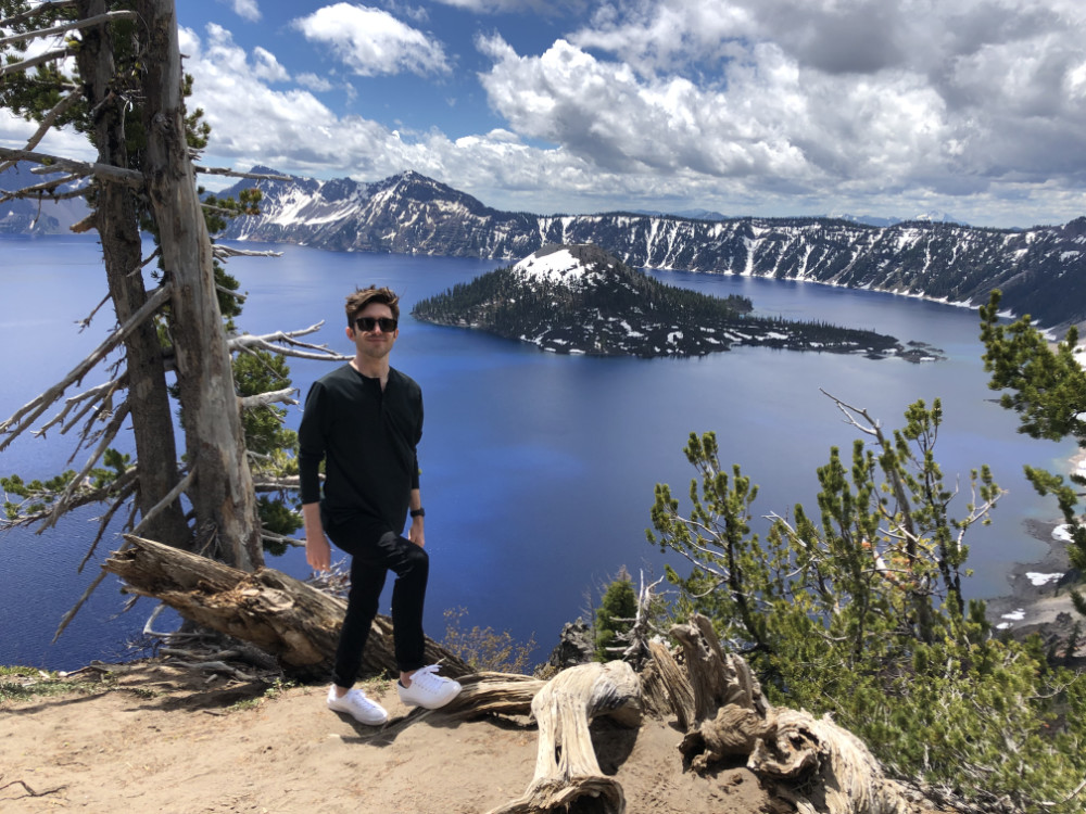 Tyler standing above Wizard Island at Crater Lake