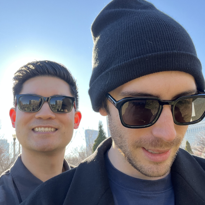 Tyler and Justin in sunglasses smiling