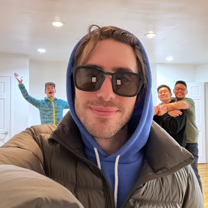 Tyler in sunglasses with three people around the perimiter
